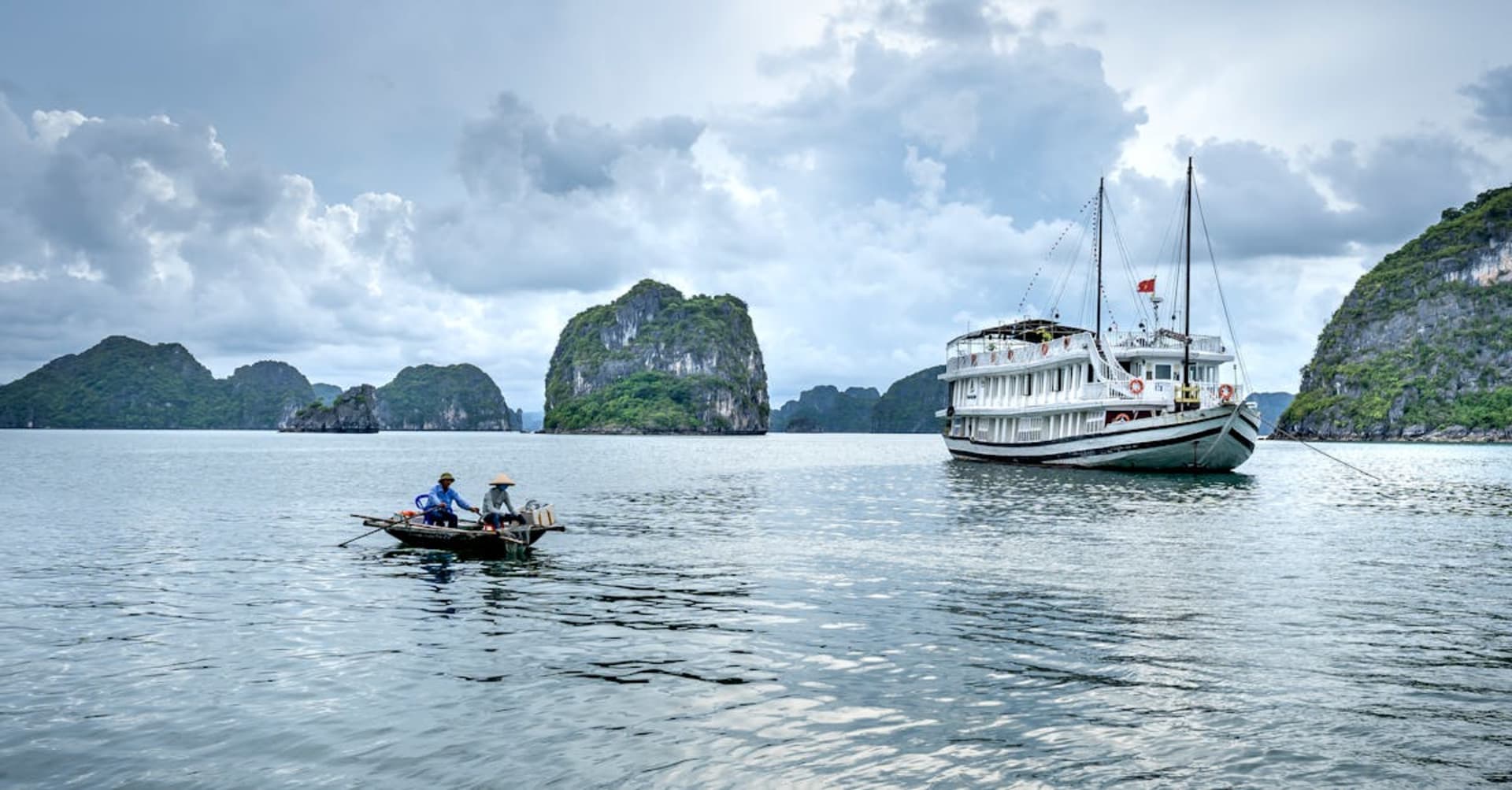 Limestone karsts rising from misty emerald waters in Ha Long Bay