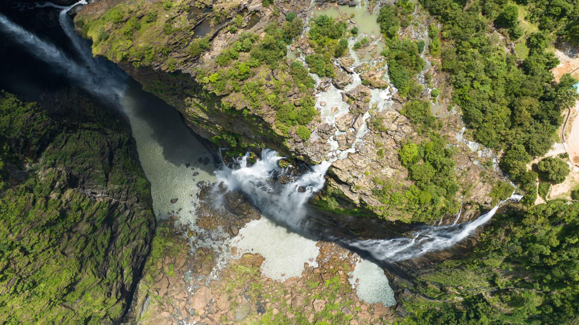 The Kalambo River falling in a single thin column off a sheer cliff into a deep gorge near Lake Tanganyika