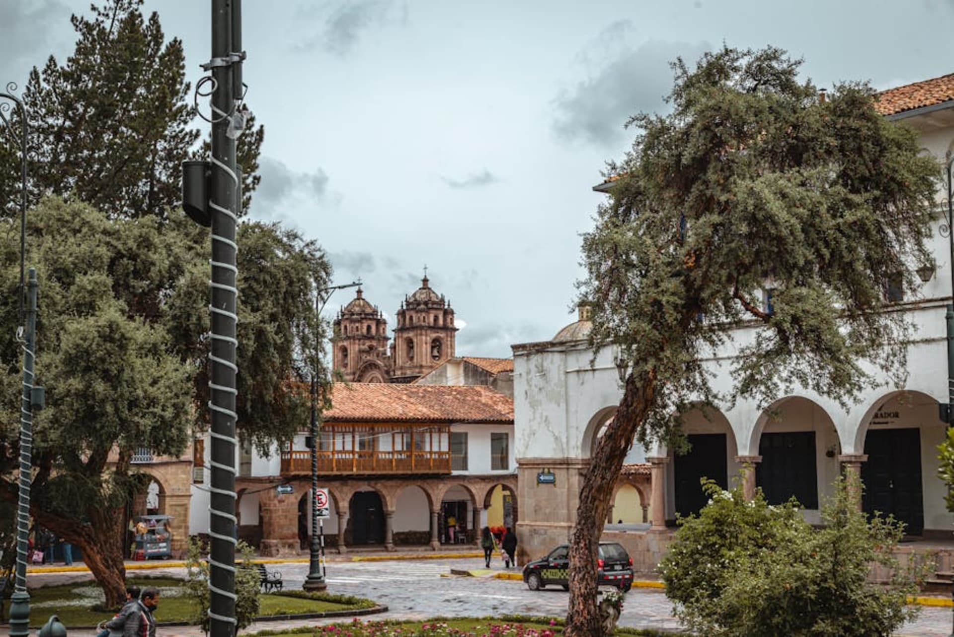Cusco's colonial rooftops and church towers against Andean mountains