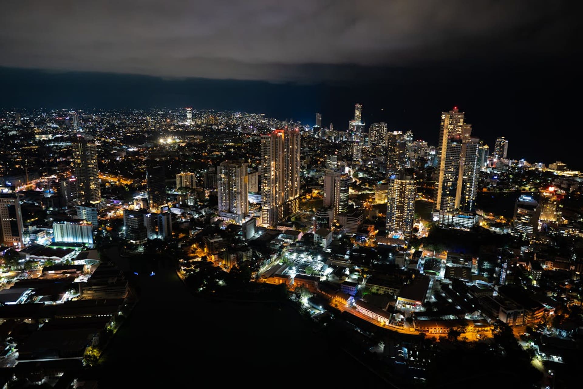 Blue train winding through emerald tea plantations in Sri Lanka's hill country