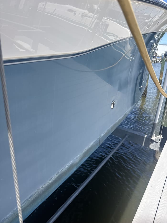 Boat hull before oxidation removal Tampa Bay