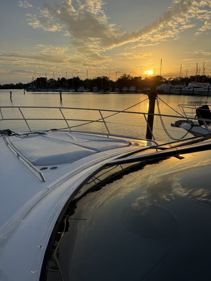 Yacht polished hull sunset Tampa Bay marina