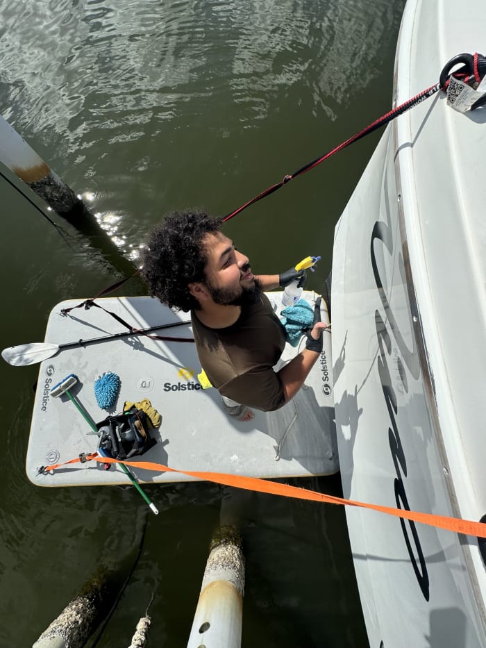 Mobile boat detailing Tampa Bay working at waterline