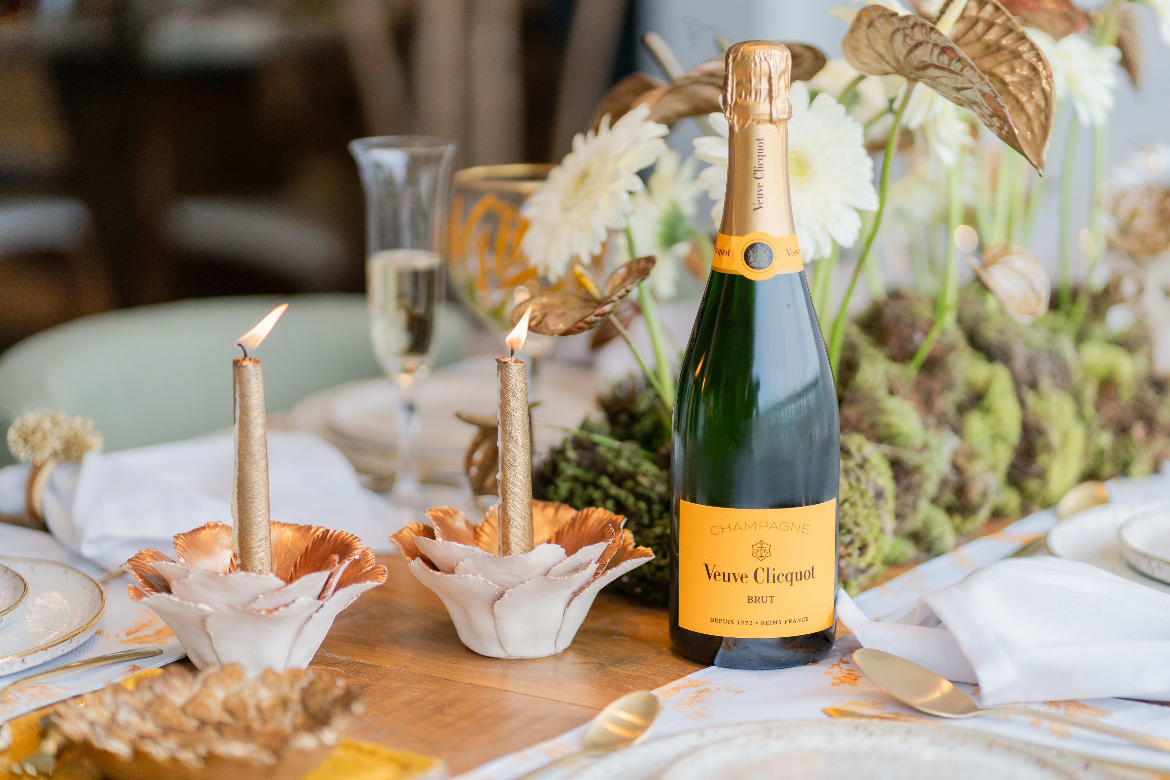 Two sparkling wine flutes side by side, one with Prosecco and one with Champagne, on an elegant table
