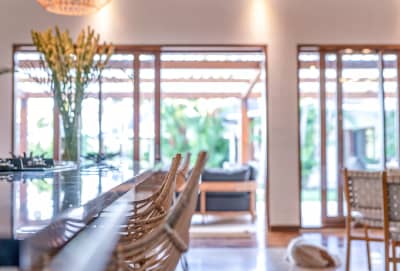Spacious dining area with garden views through large glass sliding doors