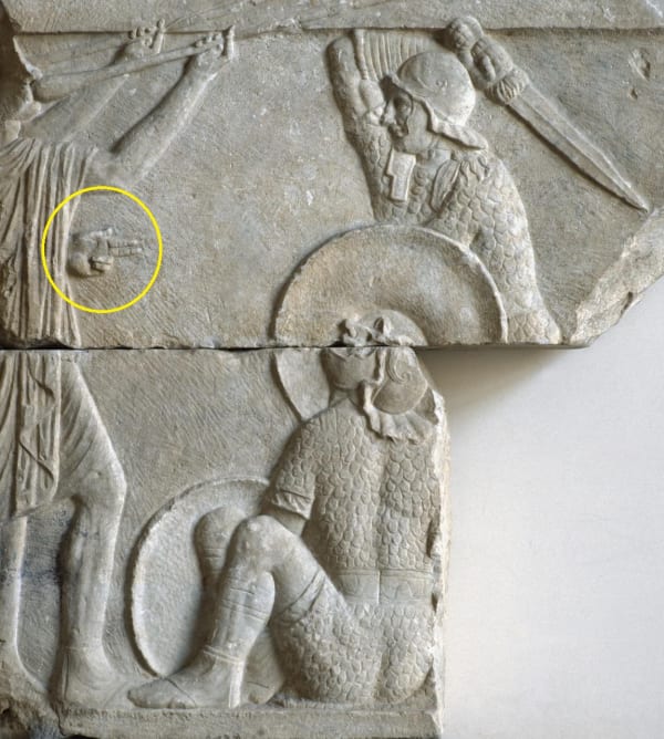 Relief sculpture from the Rome area. Gladiator about to kill defeated opponent.