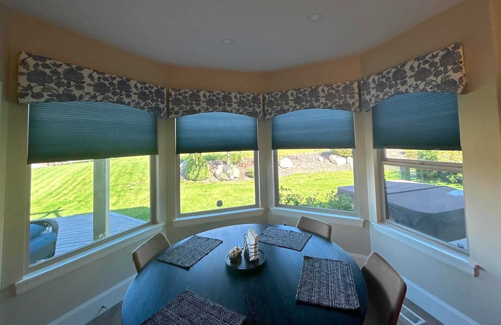 Cellular shades with floral printed fabric cornices in kitchen