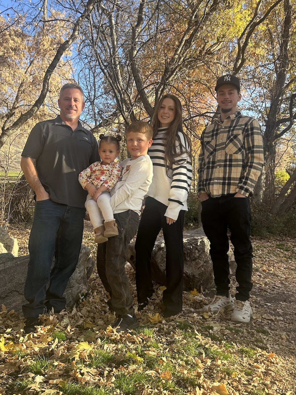 Fry family smiling gathered outdoors
