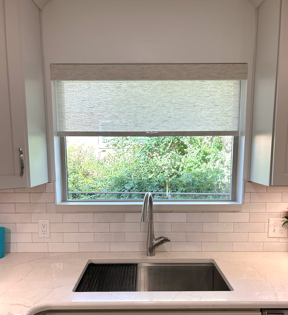 Roller shades in four windows inside country club