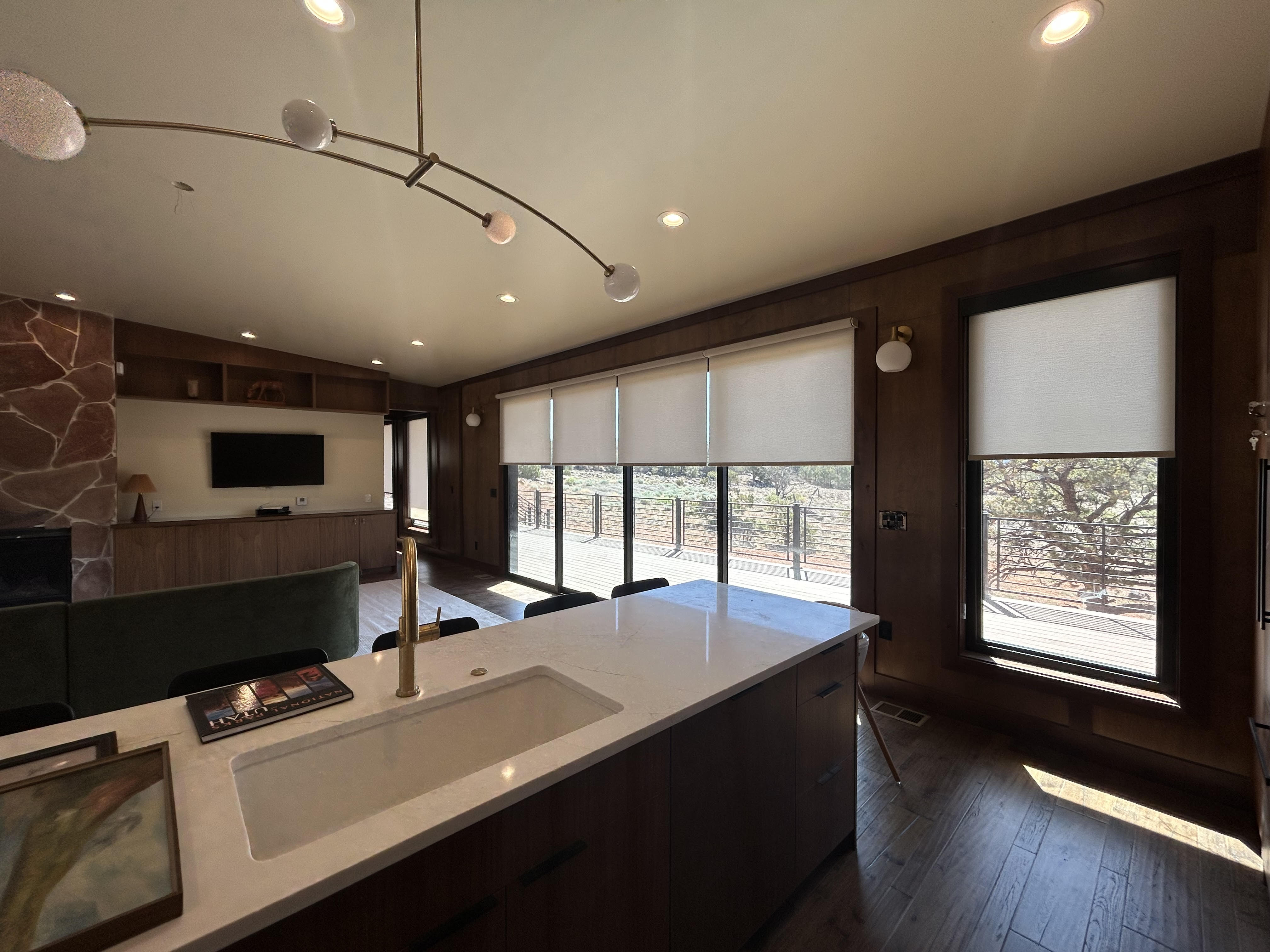 Roller shades in four windows inside country club