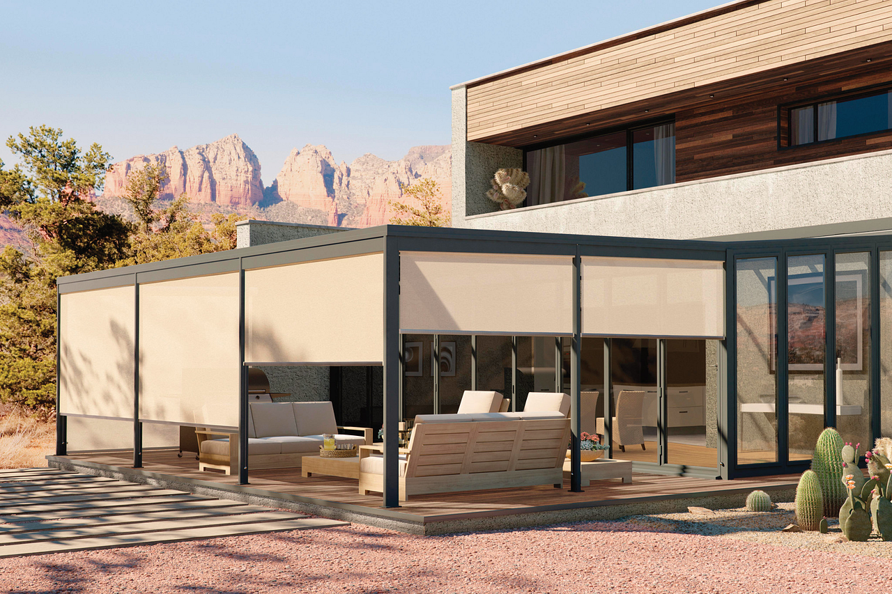 Exterior roller shades on a patio frame in a desert setting