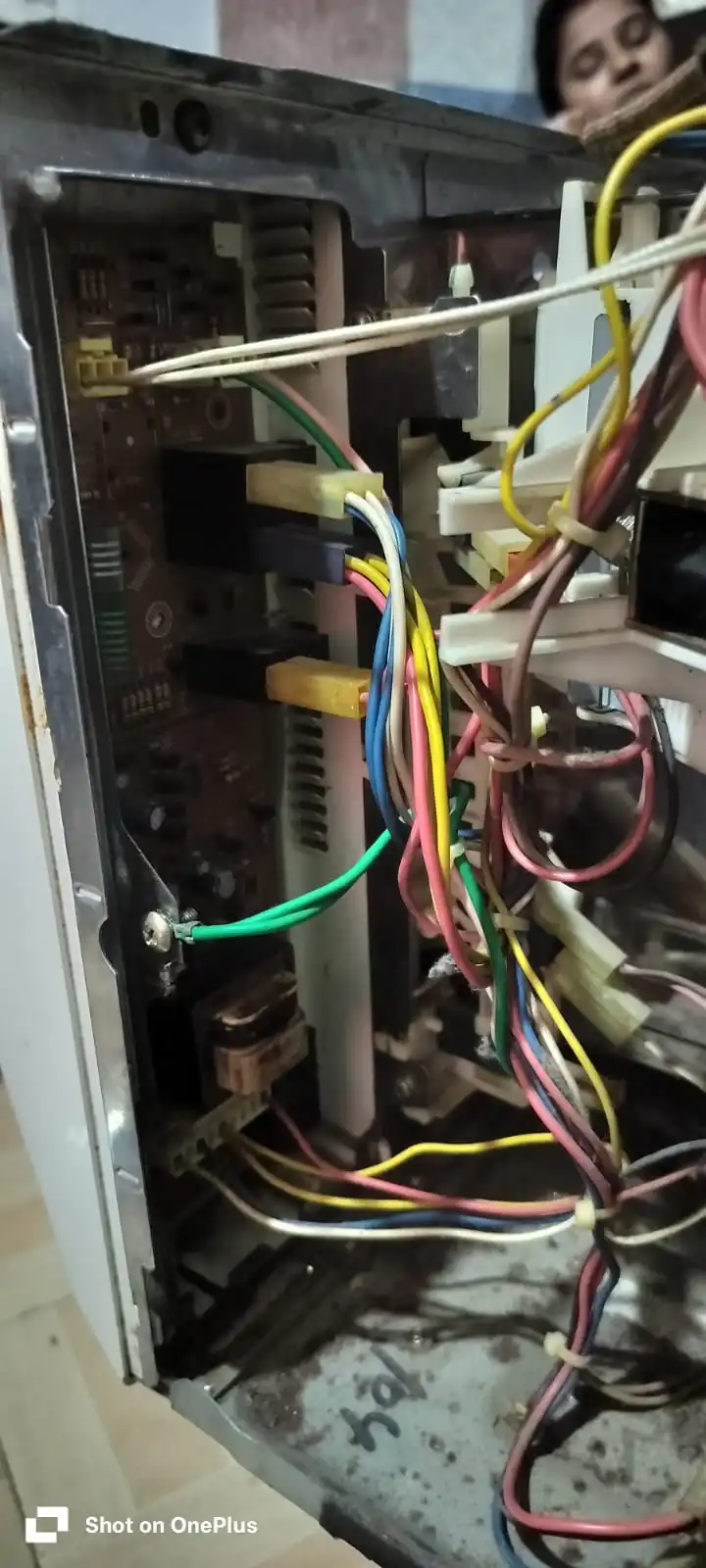 Close-up of a replacement appliance motor with the label visible