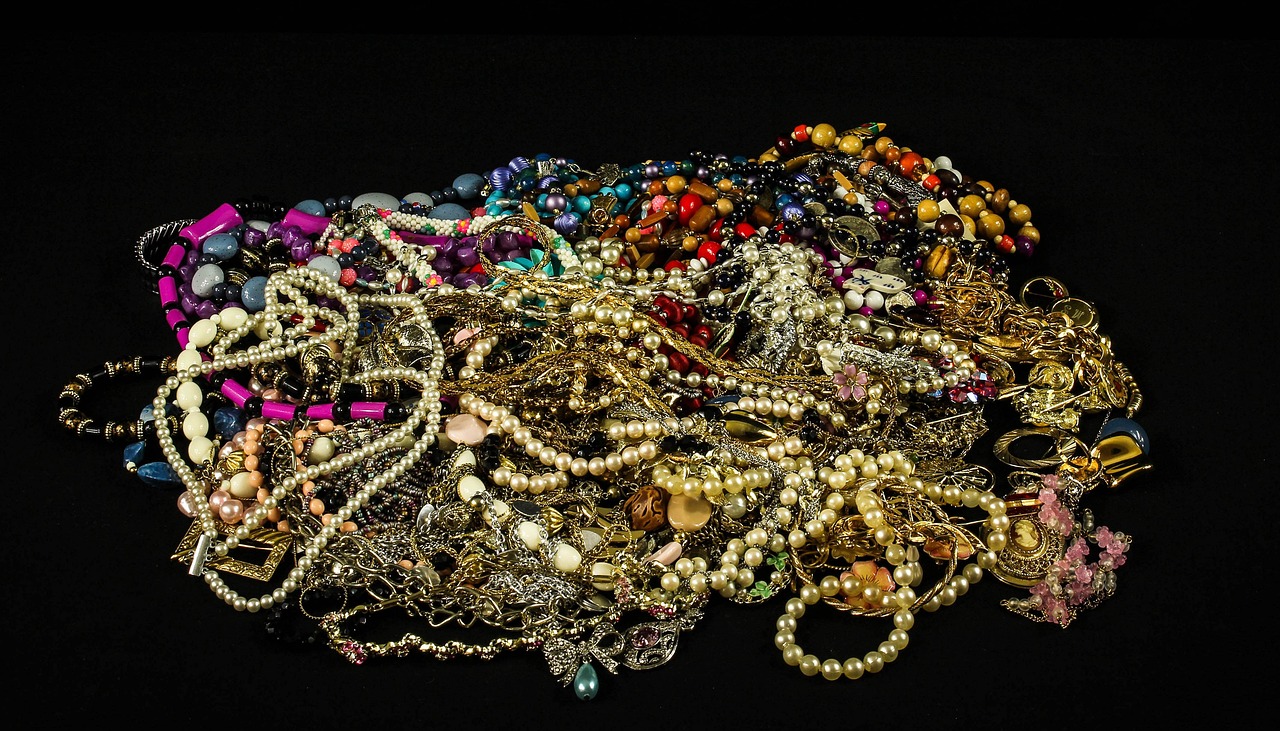 Intricately carved cameo jewelry with layered stone colors.