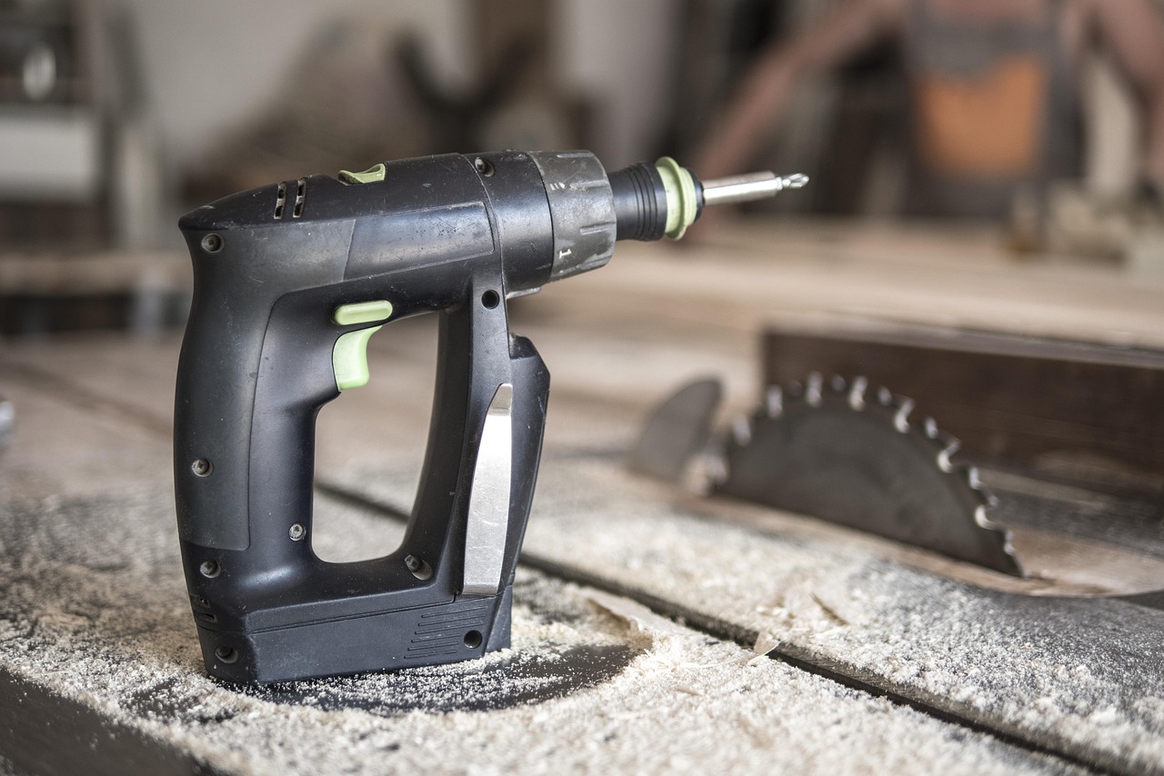 Bosch orbital sander and Metabo compound miter saw tools.