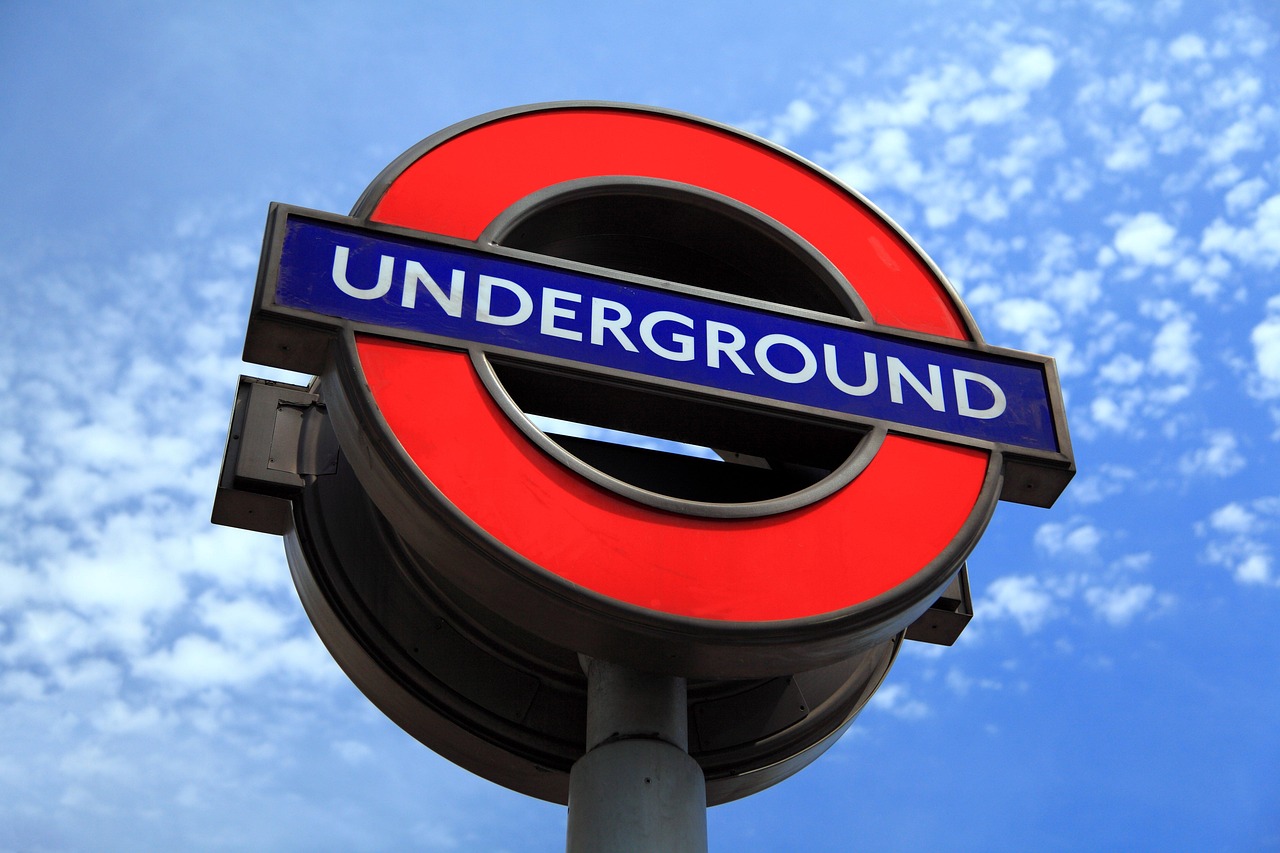 Celebrities packed on busy Central line London Tube ride.