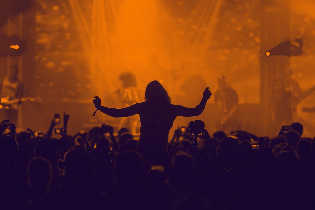 TRNSMT festival crowd vs indie band Kneecap performing live.