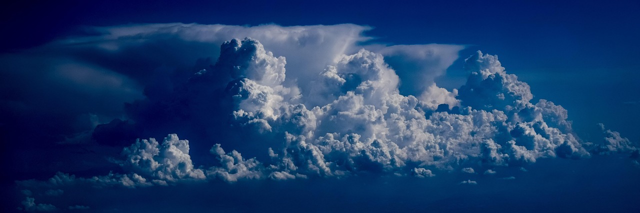 Cloud seeding process with silver iodide for rain enhancement.