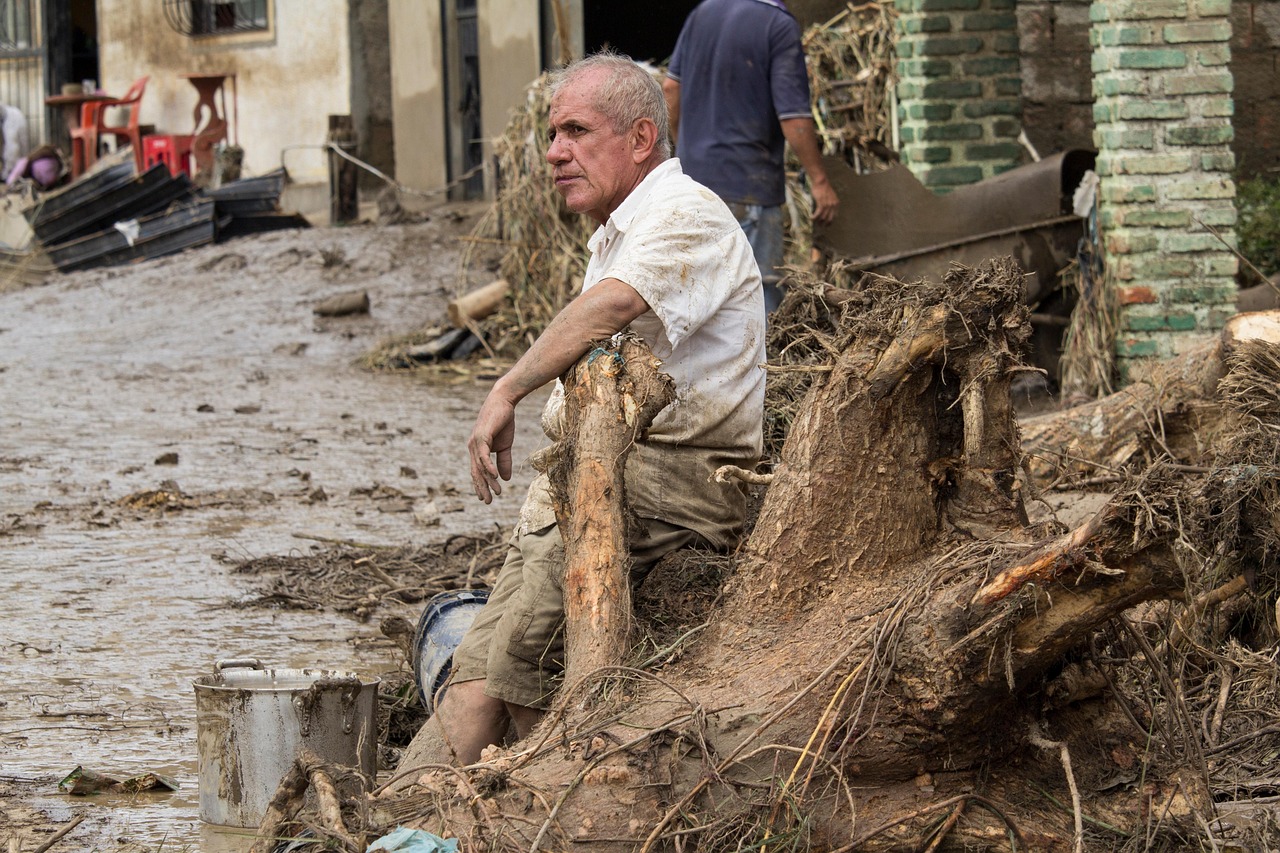 Flooded Texas street highlighting disaster recovery needs.