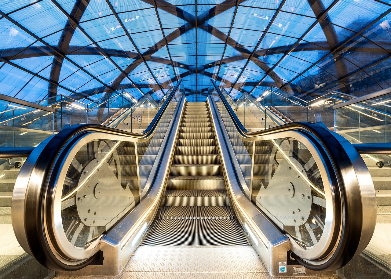 People navigating social etiquette on a crowded escalator.