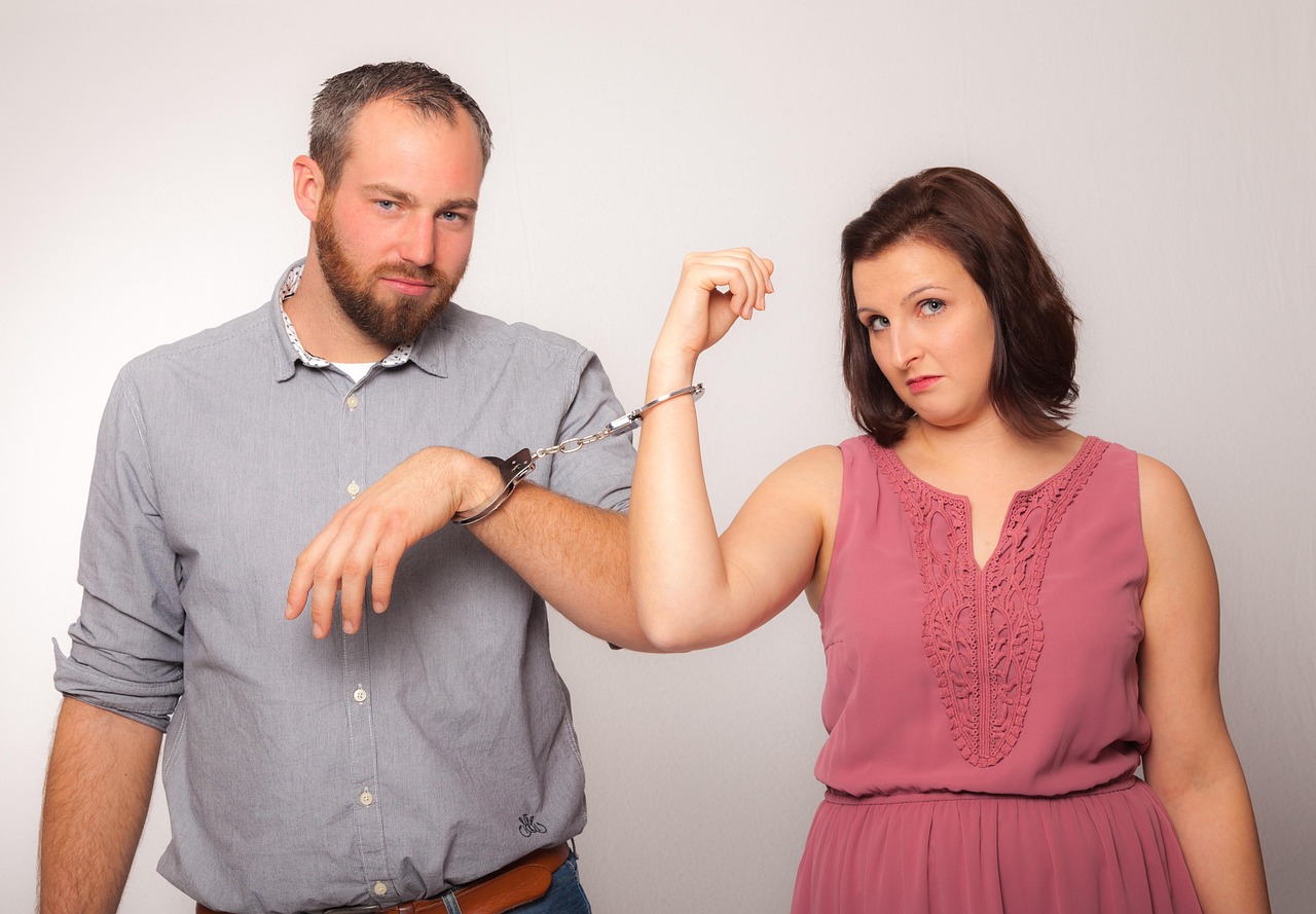 Couple discussing finances harmoniously in a relationship dance.
