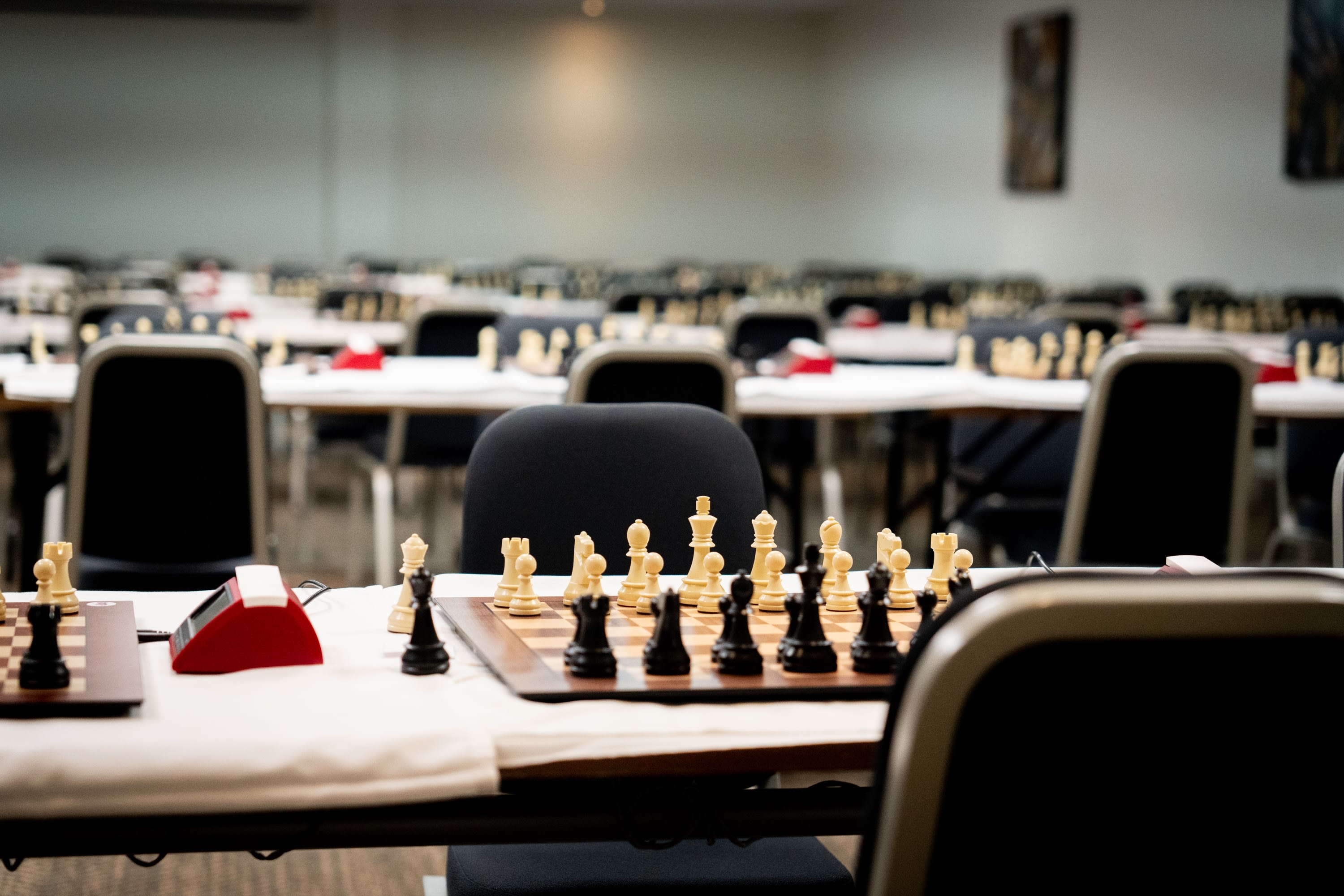 Chess photography — players concentrating over the board