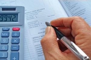 Picture of a man calculating financial costs