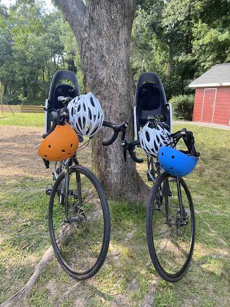 two road bikes with bike carriers attached