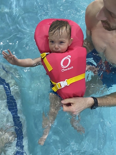 my daughter in a baby life jacket 