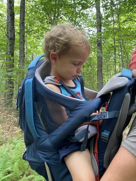 napping in toddler hiking backpack