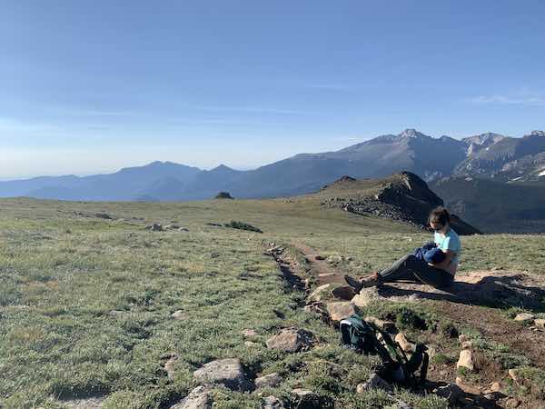 breastfeeding baby on trail while hiking with a baby