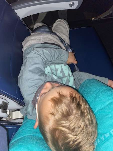 Toddler sleeping on airplane 