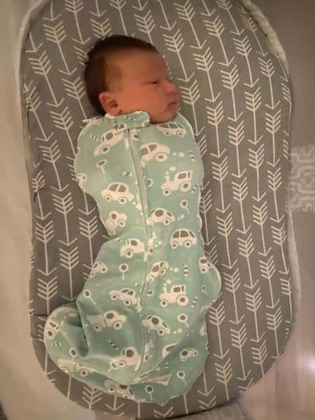 Woombie grow with me swaddle suit