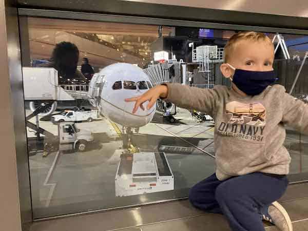 toddler getting ready for international flight