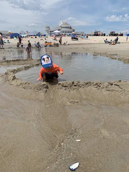 toddler beach essentials way to have fun: build a dam