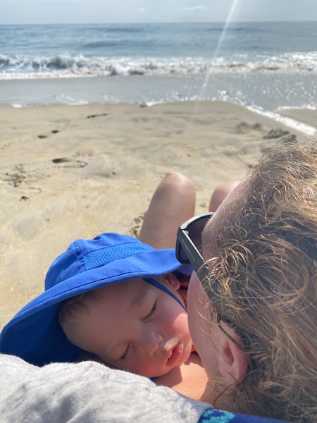 my baby sleeping on me at the beach