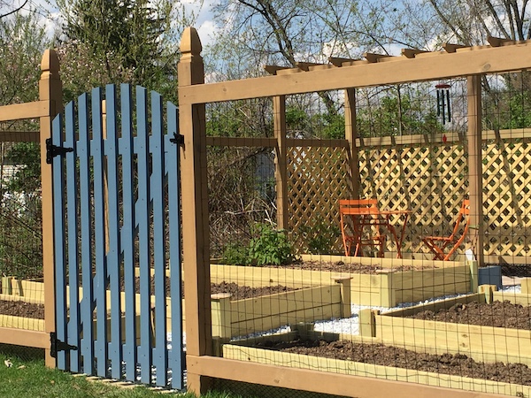 fenced in garden for mom cafe table and chairs