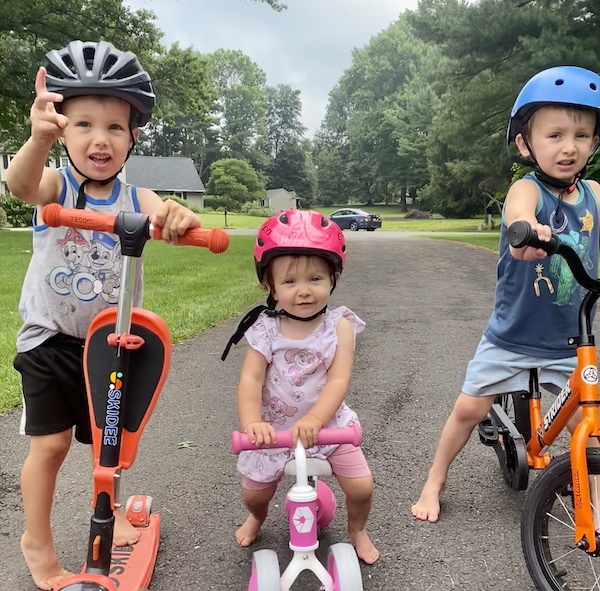 my three kids 1, 3 and 4 in toddler helmets