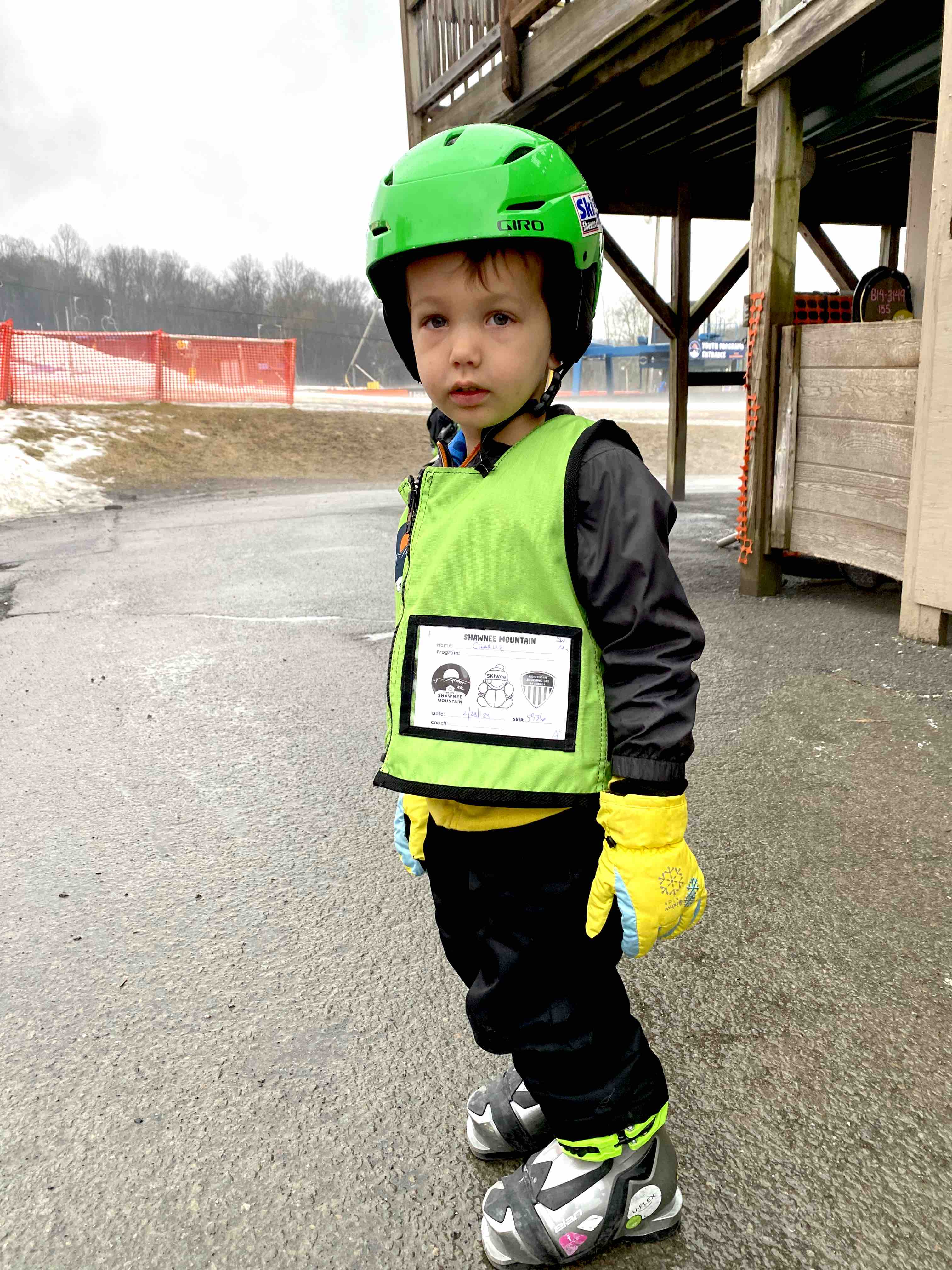 3 year old boy wearing snowboots