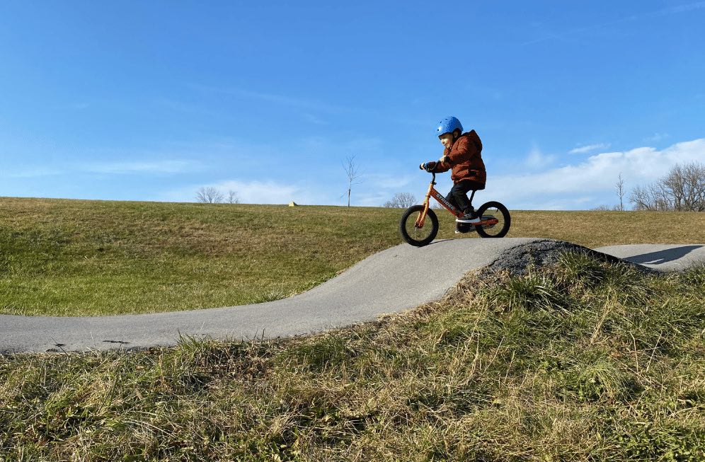 how to motivate your child to ride his bike: take them to the pump track to ride bikes
