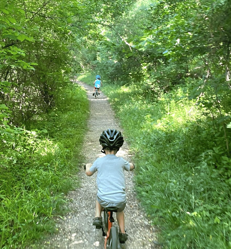how to motivate your child to ride a bike: take bikes on vacation state park photo