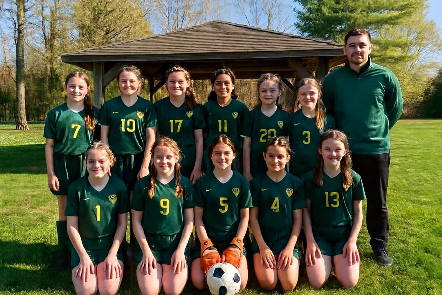 U12 Girls, spring picture day. Ella in the gloves, front row.