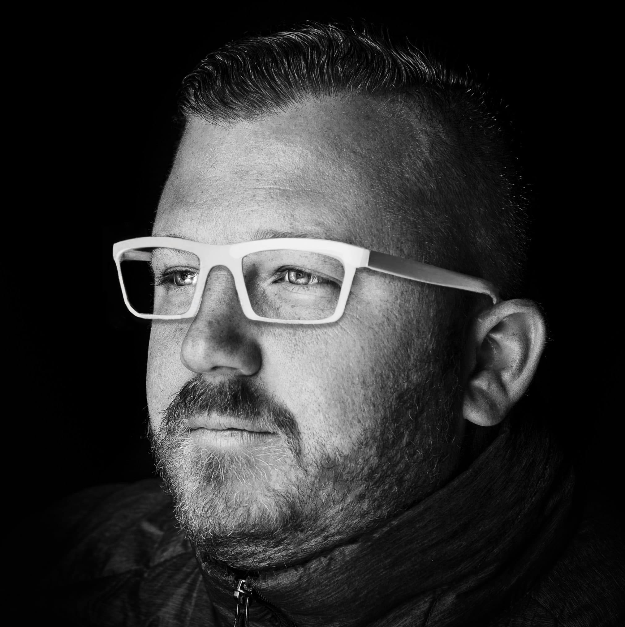 Bryan Butterfield wearing white glasses.