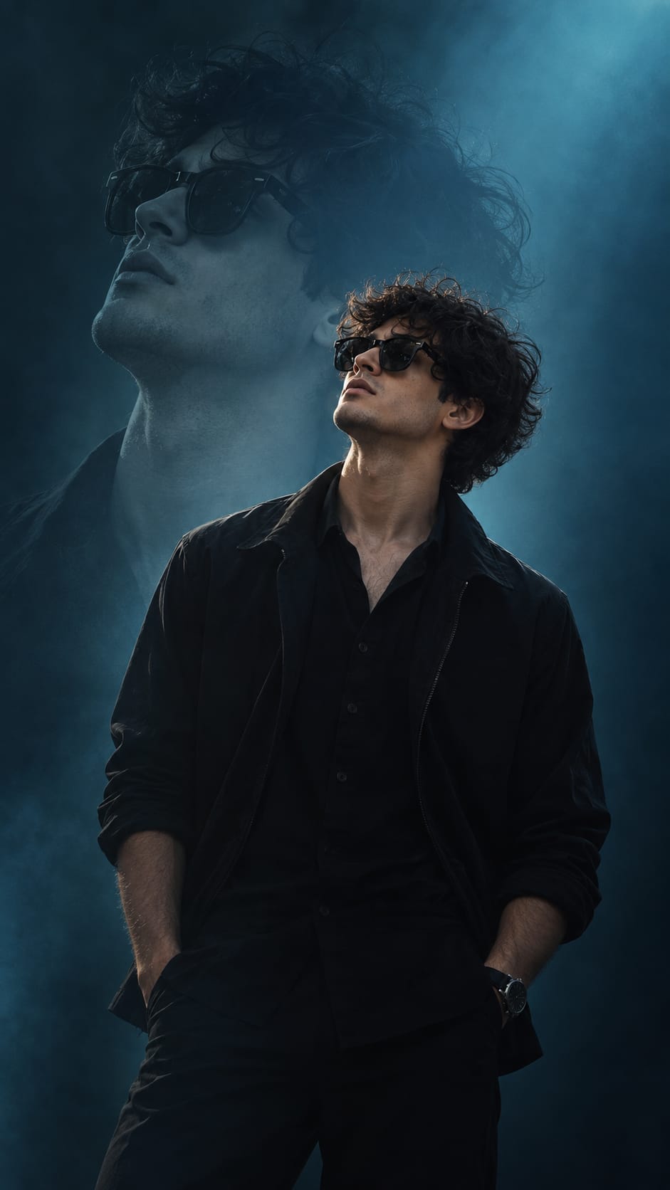 moody cinematic portrait of a man in dark jacket, front facing but slightly turned, minimal expression, dark teal and cyan studio lighting, smooth gradient blue background fading into shadows, creative double exposure ghosted silhouette behind main face, soft haze, film look, subtle grain, high contrast on facial features, poster design composition, empty space for typography, no text, no watermark — AI photo created with this prompt