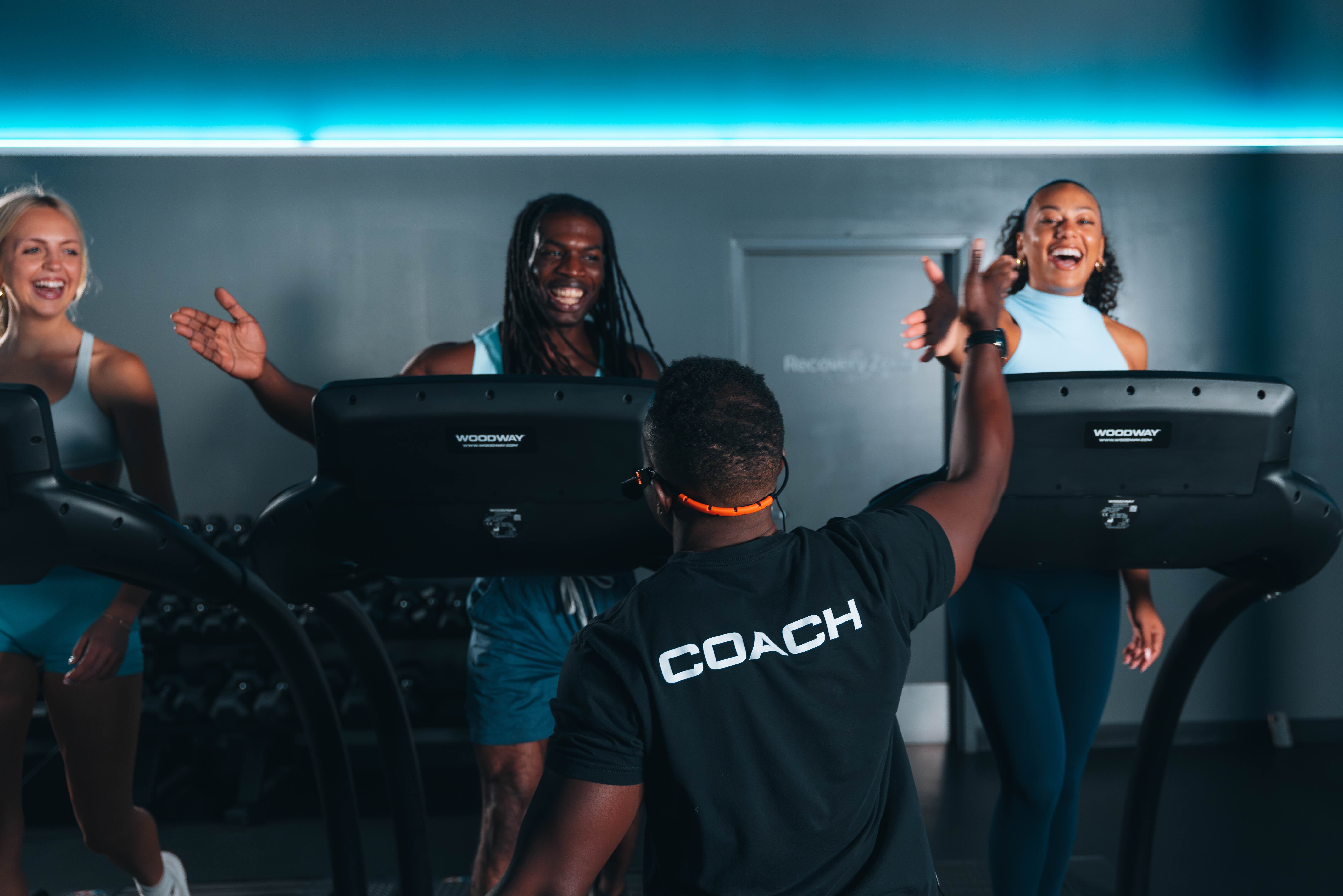 HYROX style strength and treadmill training at a STRIDE Fitness studio