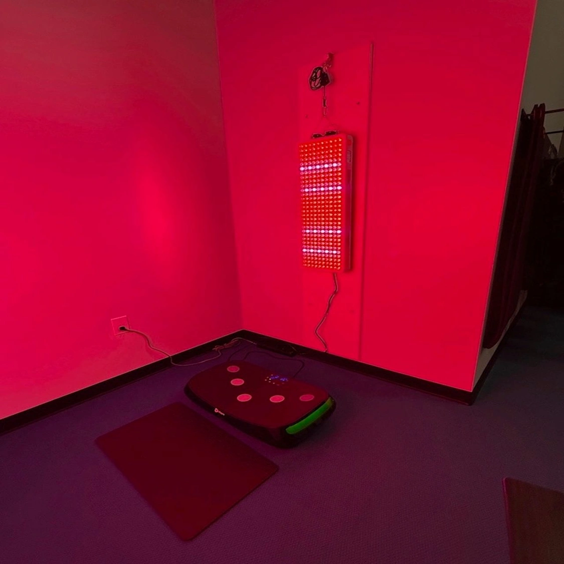 Vibration plate inside the STRIDE Fitness Recovery Zone for post-workout lymphatic drainage and circulation