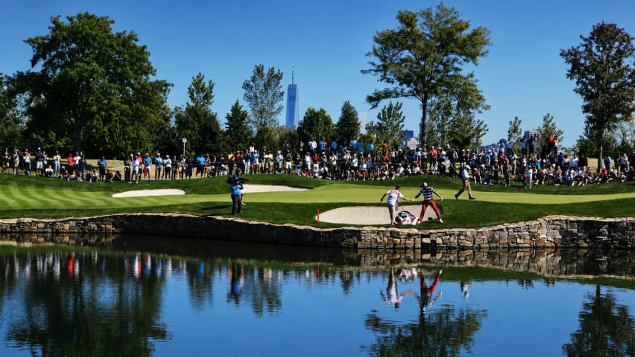 A championship golf tournament gallery ringing the green — waste and recycling managed on site