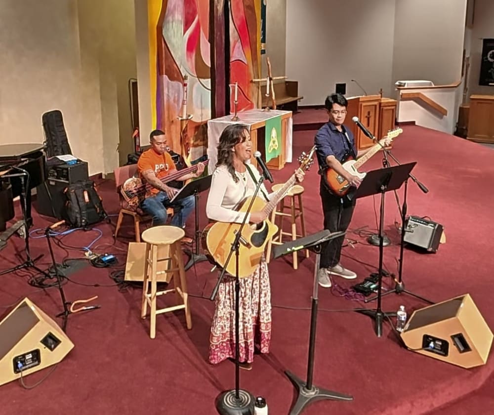 Becky Key singing with the band at Zion Lutheran Church, Fairbanks