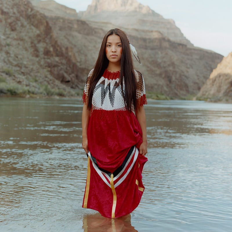 Native woman by the river