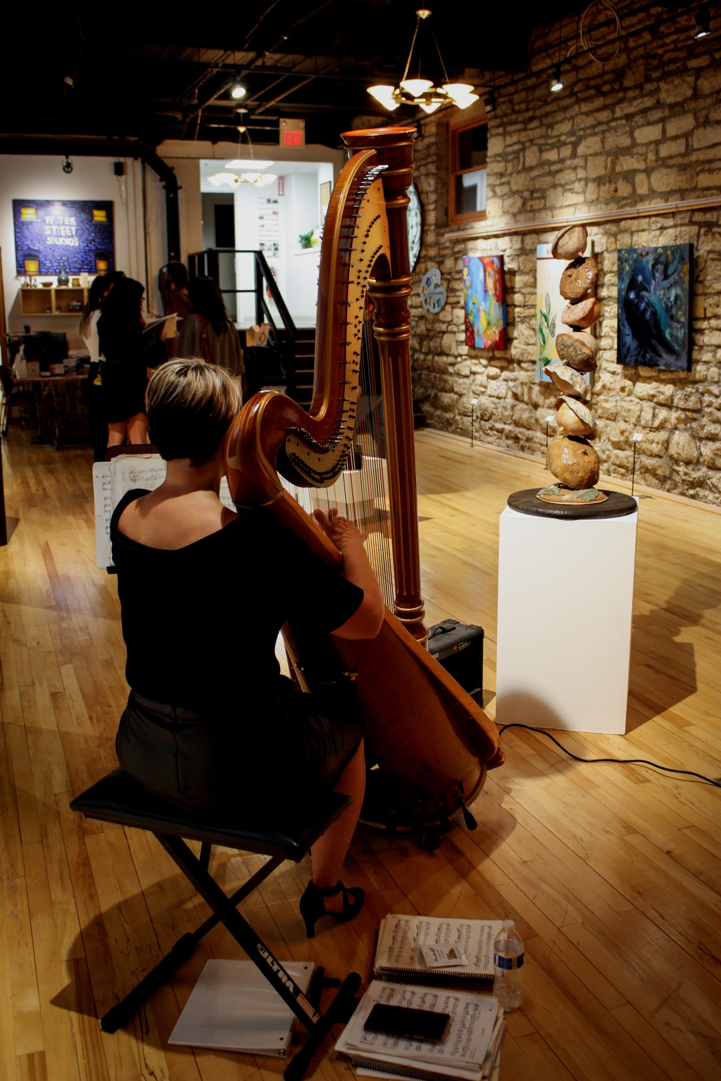 Live harp performance at Water Street Studios gallery