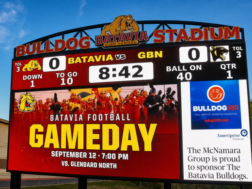 Batavia stadium digital scoreboard on game day showing sponsor recognition